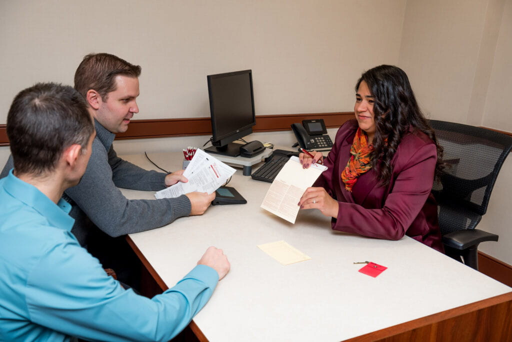 The First, a Trusted Partner. Two customers speaking with The First bank expert.