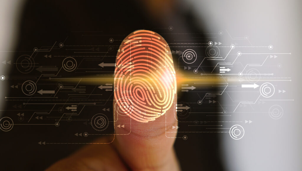 Security Tips - Businessman login with fingerprint scanning technology.