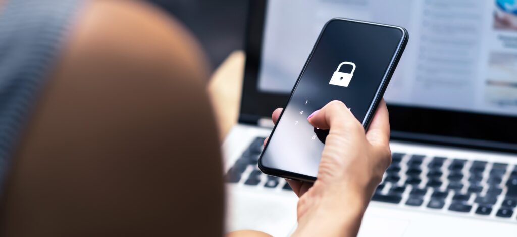 Phishing, mobile phone hacker or cyber scam concept. Password and login pass code in smartphone. Online security threat and fraud. Female scammer with cellphone and laptop. Bank account security.