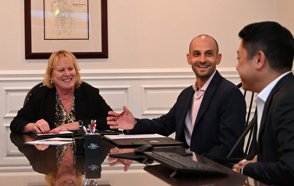 Wealth management team members discussing strategies