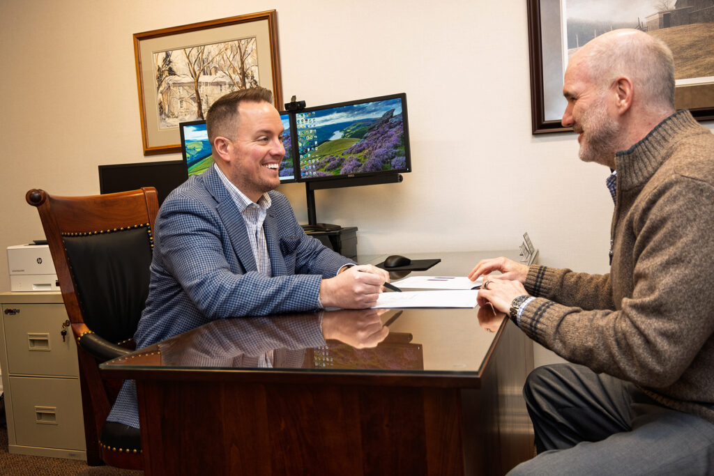 Wealth management team conversing with a client